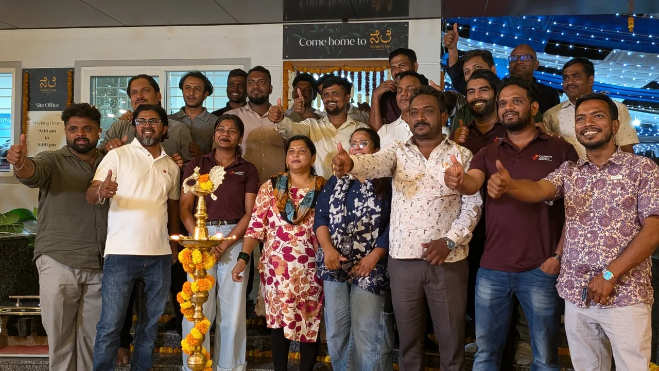 Nature’s Lap · A group photograph at the site office.