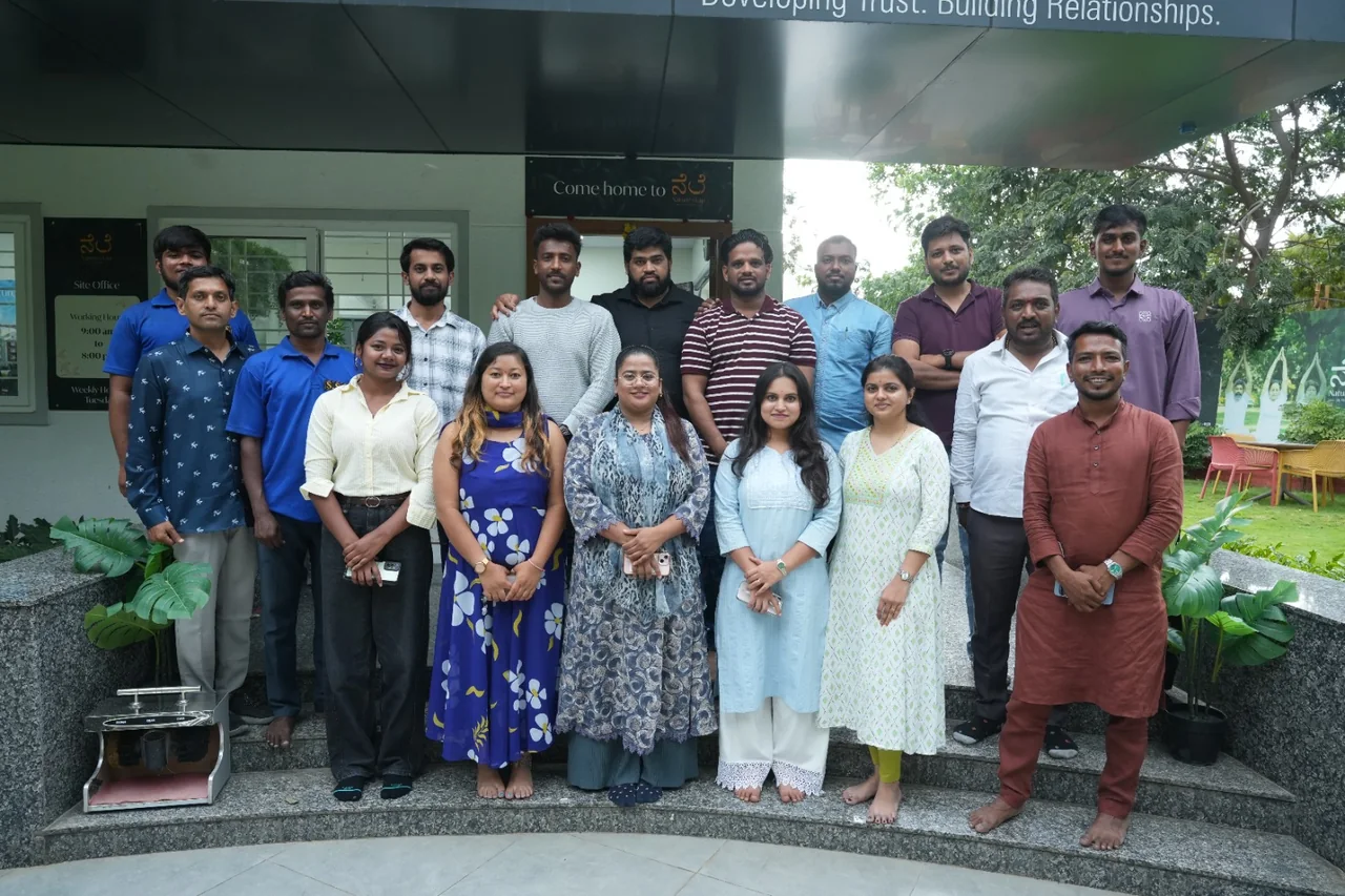 Nature’s Lap · A gathering at the project office.